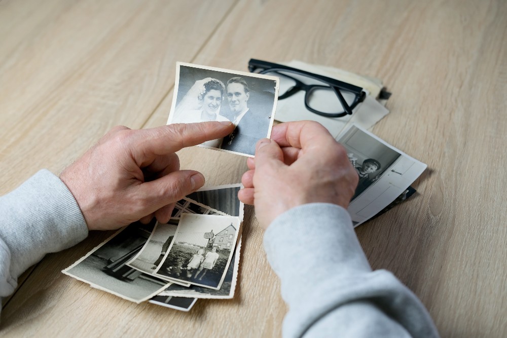 Looking at old pictures to perserve memories while downsizing your home